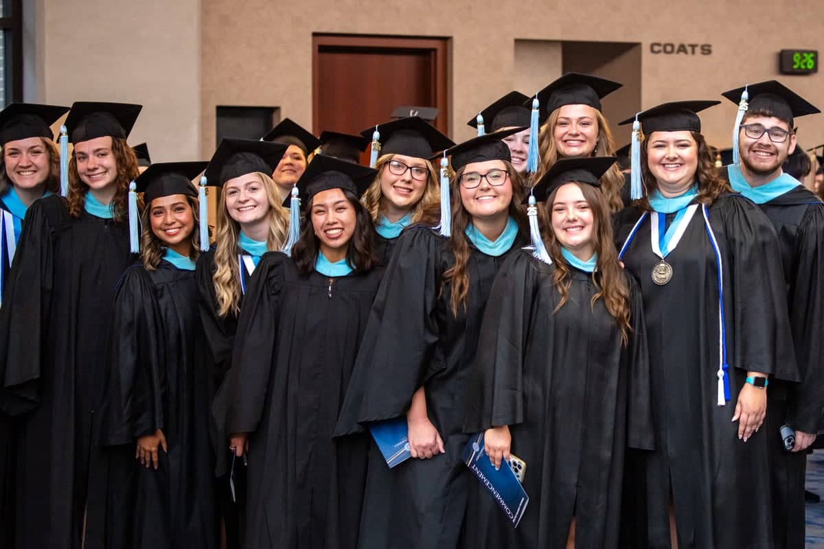 Graduates pose for a photo at the PCC Commencement 2025