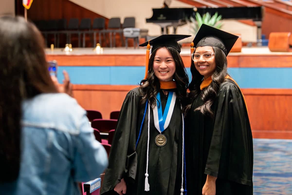 Graduates stand for a photo at the Arts and Science PCC Commencement 2025