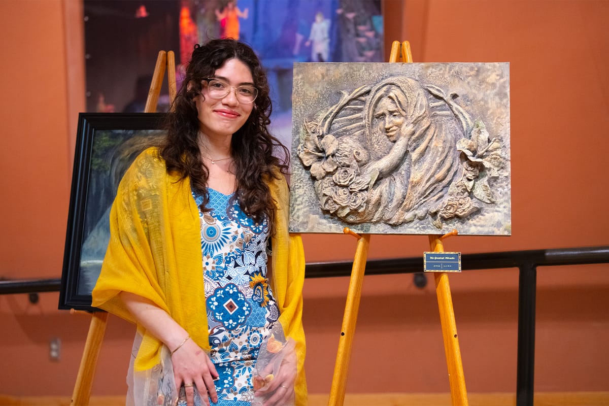 Visual Arts Student with Senior Show Piece