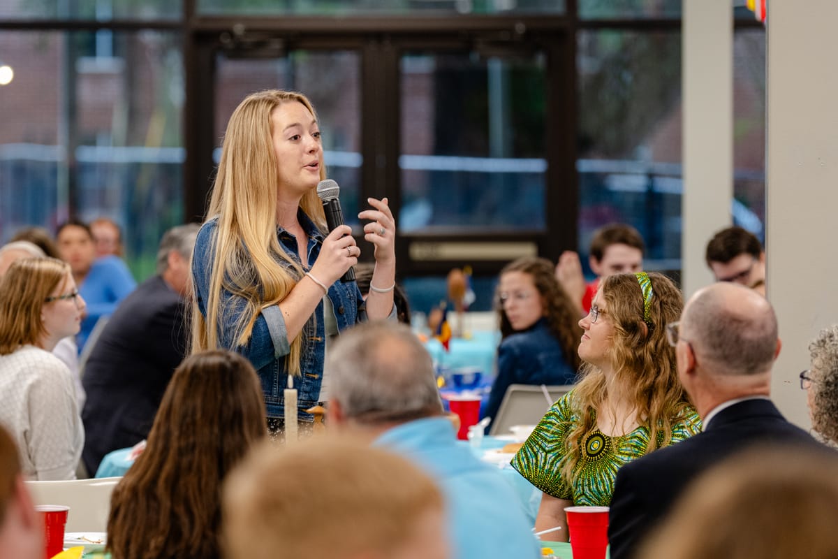 Student speaking at Missionary Kid's Lunch