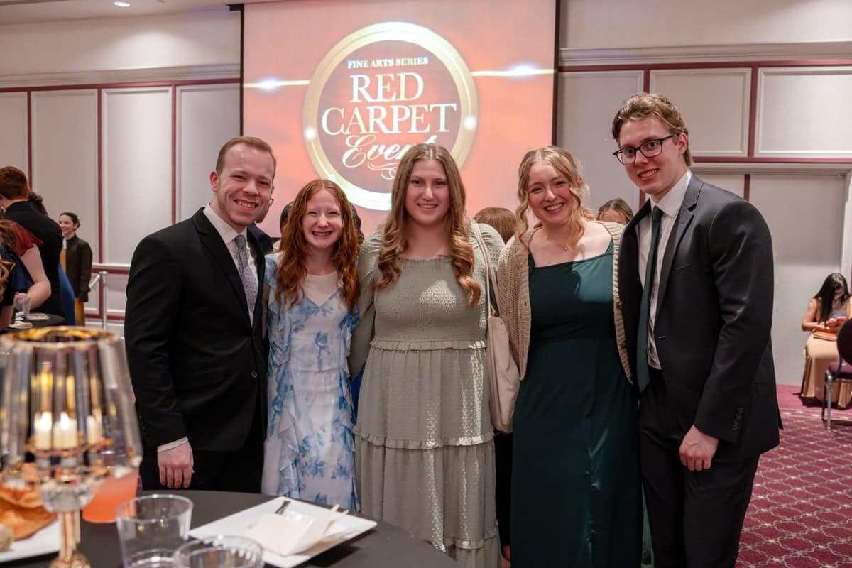 PCC students huddle in for a group shot at the PCC Red Carpet Event.