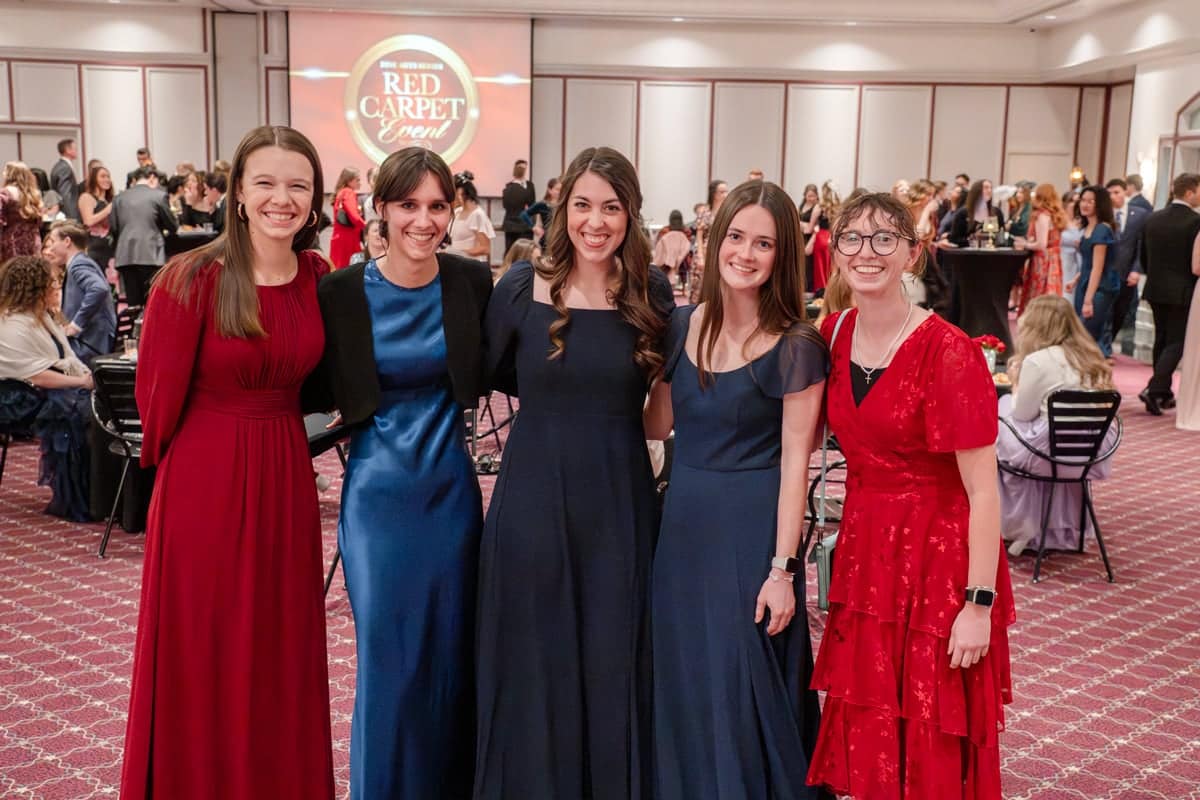 PCC students huddle in for a group shot at the PCC Red Carpet Event.