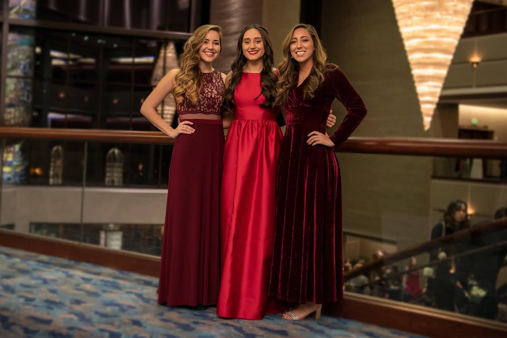 Three girls pose together