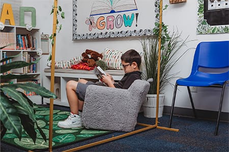 Child reading in Hope Children's School