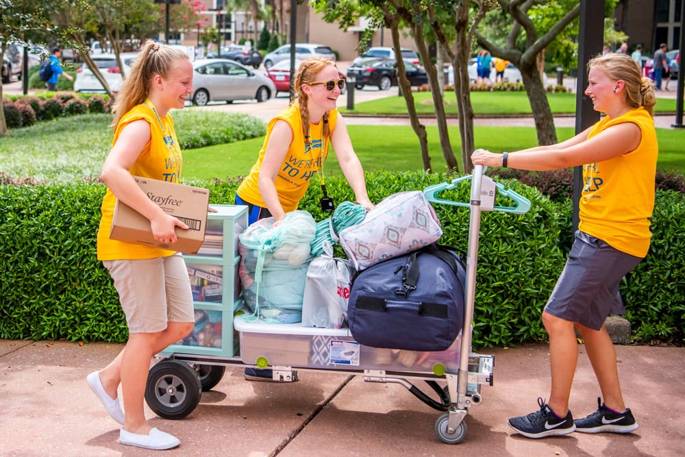 Residence assistants helping move in