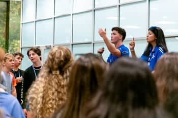 Team Extreme team leaders speak at a meeting in the sports center