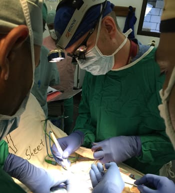 Alumni Dr. Brett Dempsey performing surgery