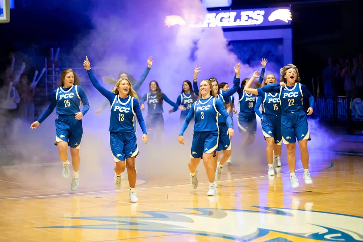 PCC Lady Eagles run onto the floor at Eagles Fan Fest