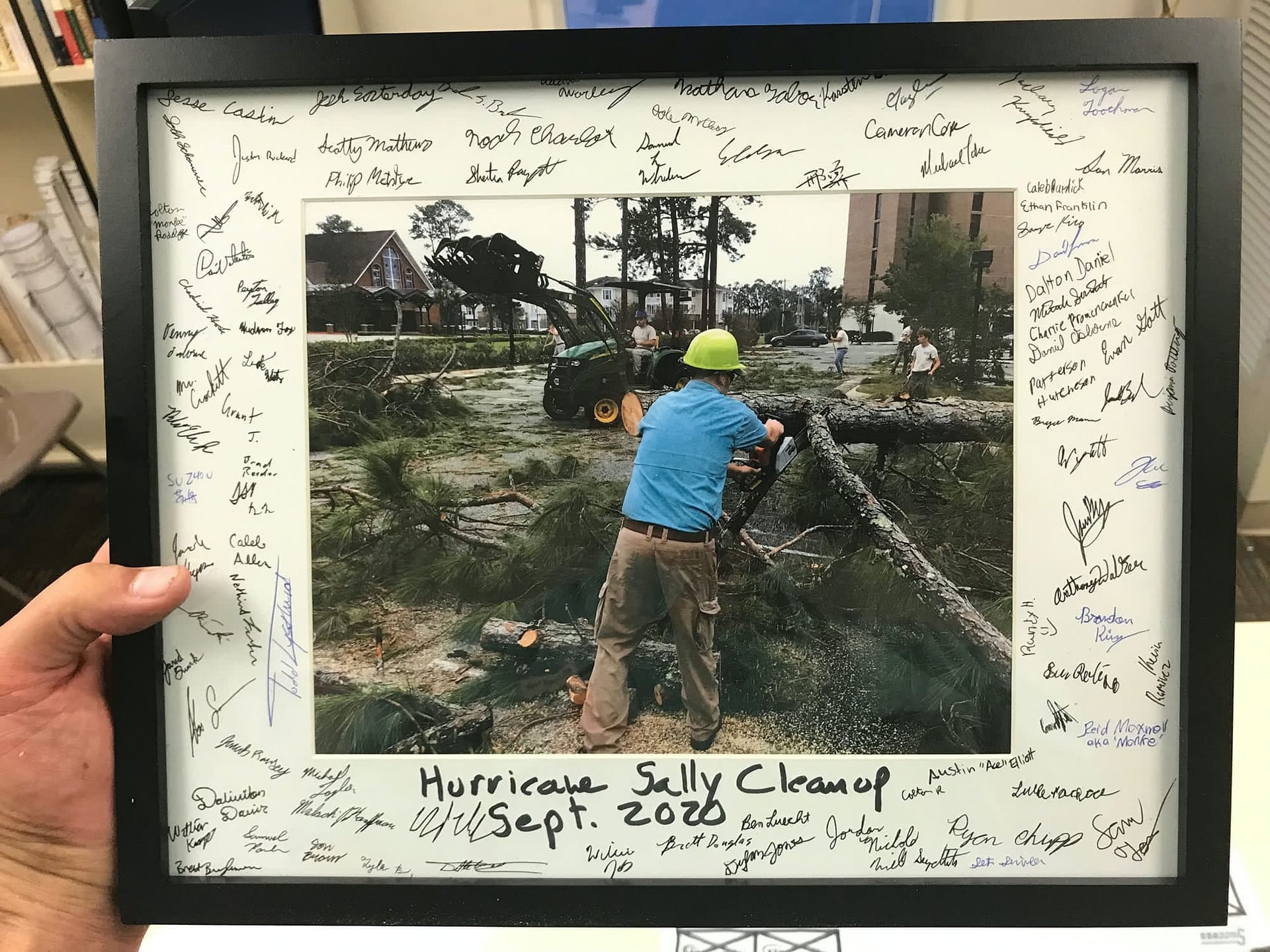 The grounds team has a signed image of clean up efforts as a memento