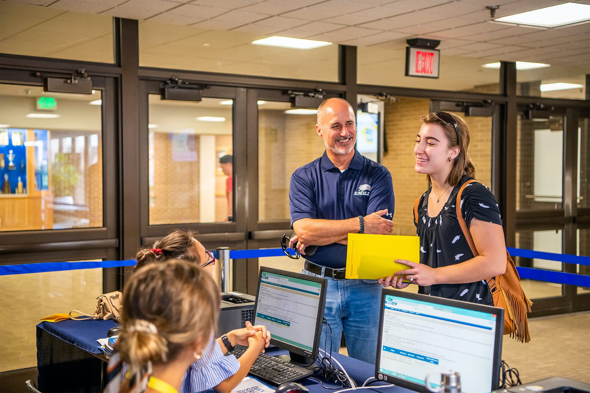 A freshman student checks in with her dad