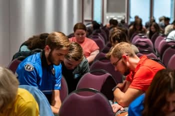 Students have a time of prayer during Missionary Prayer Band