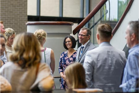 Pastor and Mrs. Redlin greet churchgoers.
