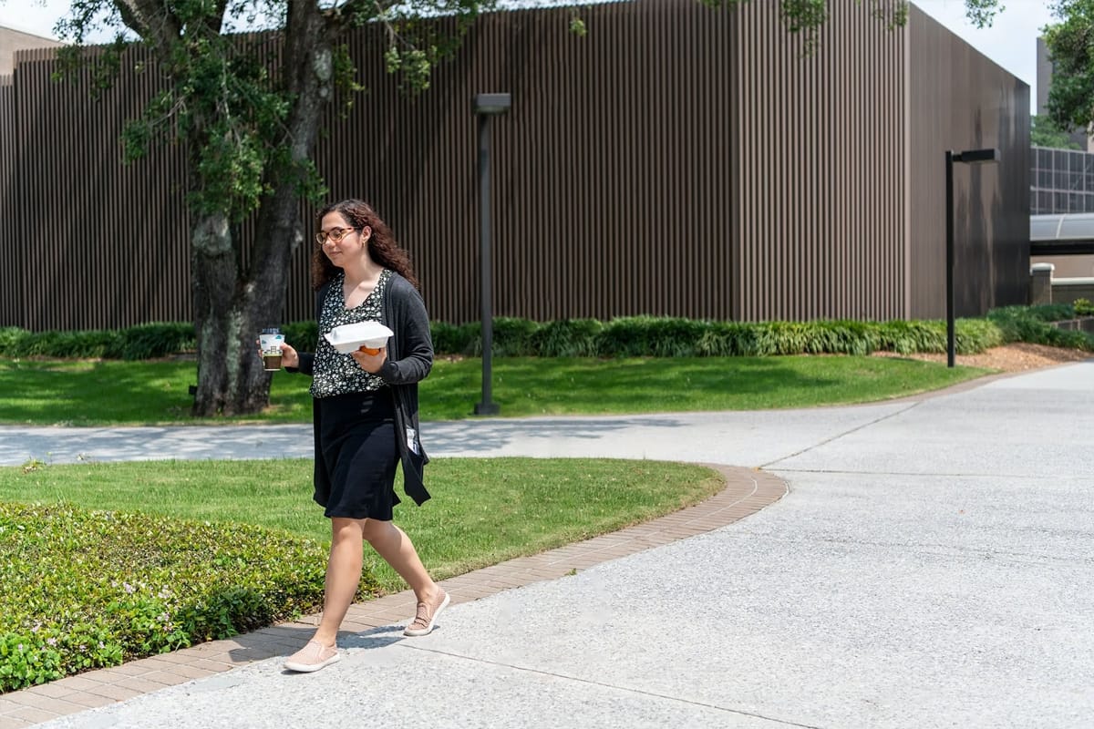 PCC Student girl with a takeout box and drink