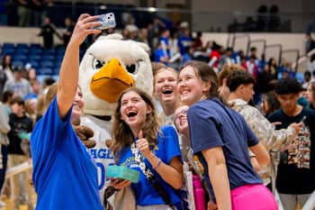 PCC mascot Eagot and PCC Girls pose for a photo at Eagles Fan Fest