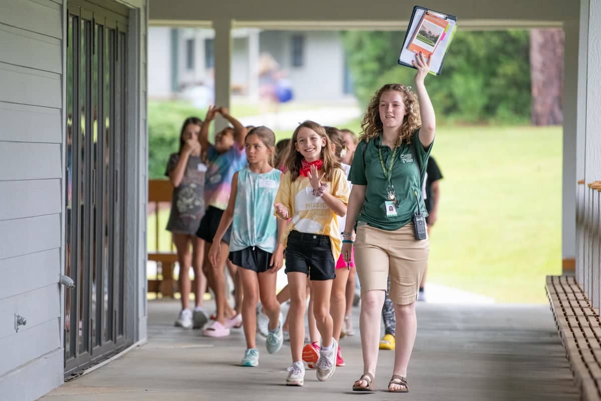 Team Leader at Camp O' the Pines leads a group of girls.