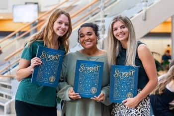 PCC girls show off their new 2024 Summit Yearbook