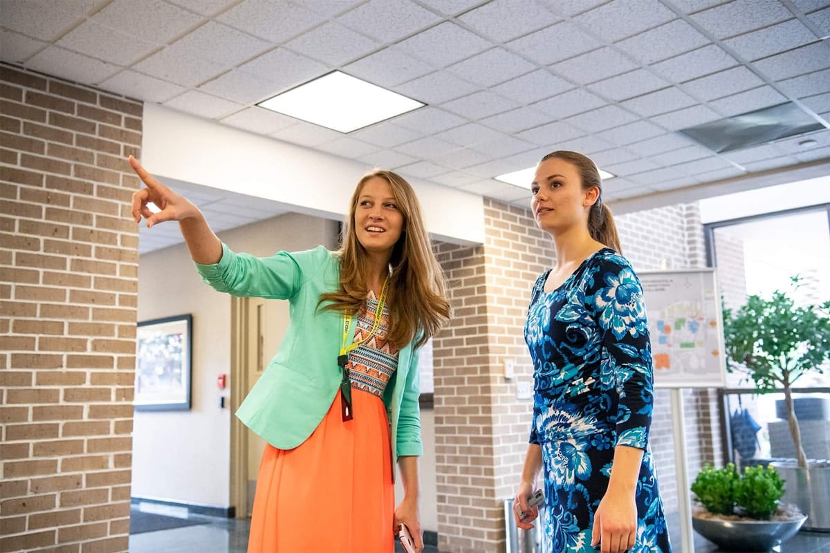 Student guide helping during check in