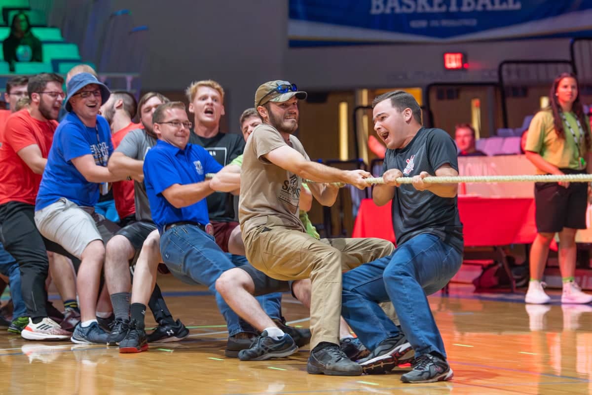 PCC Summer Workers play tug of war at a summer worker meeting