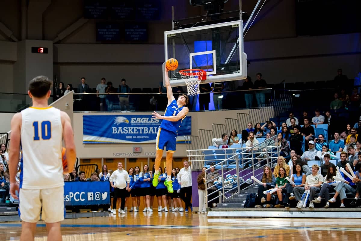 Eagles basketball athlete scores a basket at Eagles Fan Fest