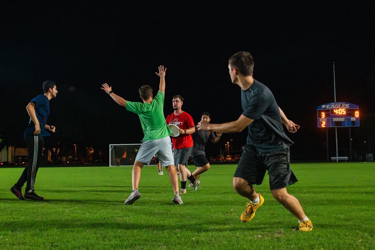 PCC Summer workers play Frisbee