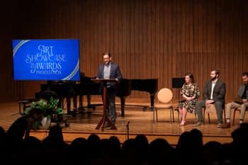 Mr. Greg Hewitt speaks at the Art showcase awards ceremony