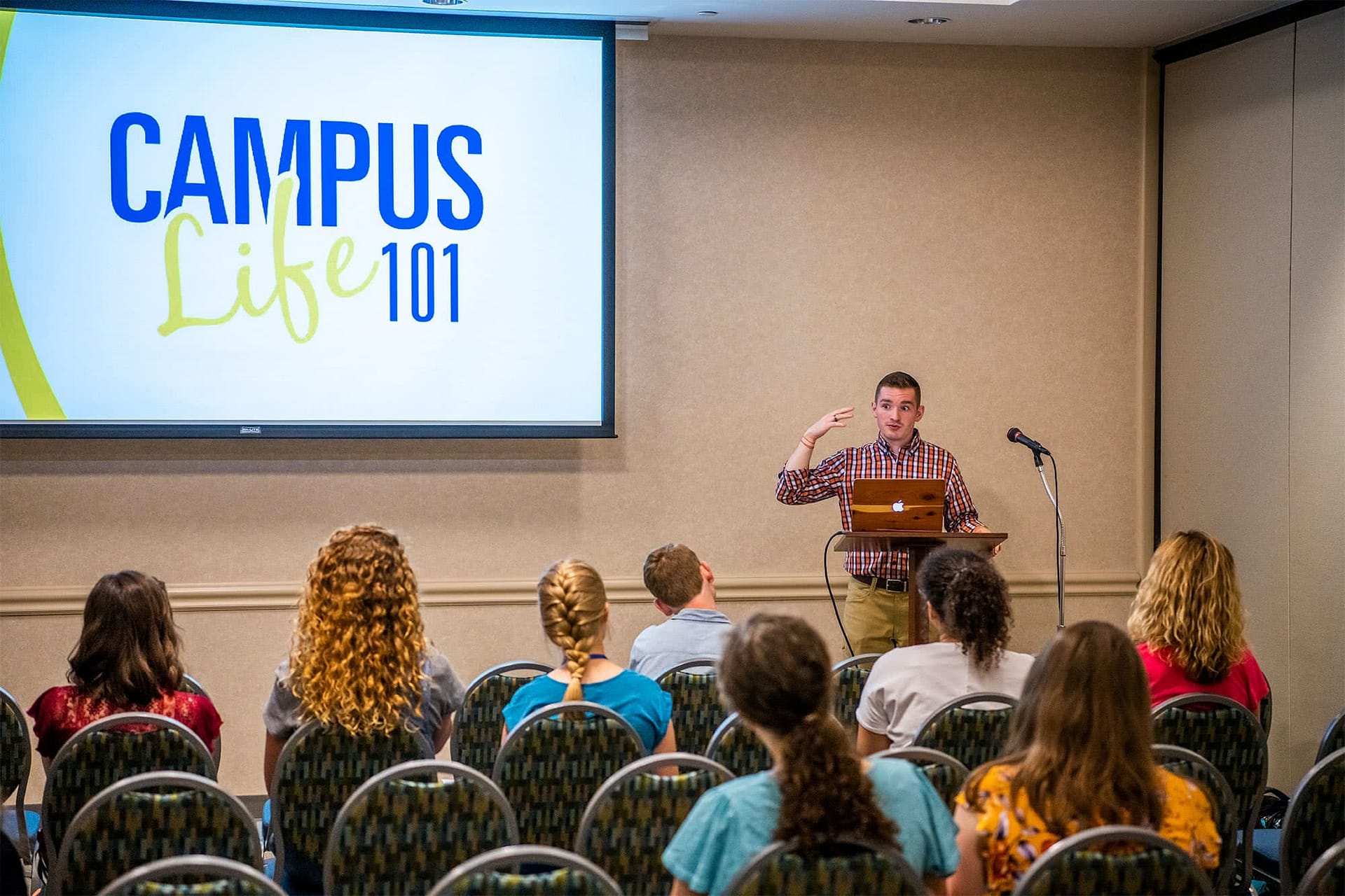 Chase Williams helps welcome freshman to campus in the Campus Life 101 meeting