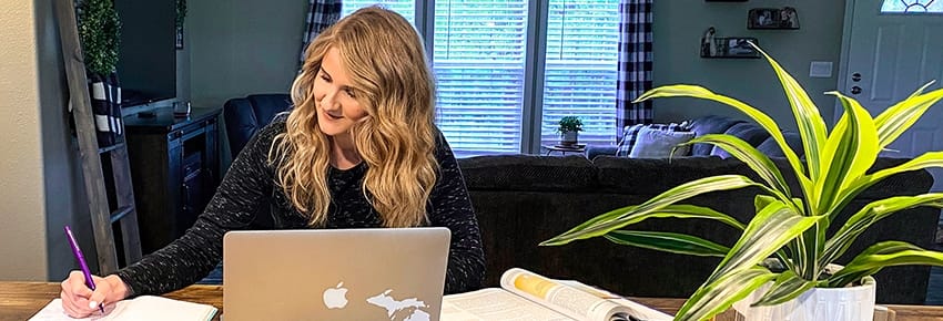 A Semester Adapting to Change. Faith Harmon studying in her family's kitchen as she finishes the spring semester from home.