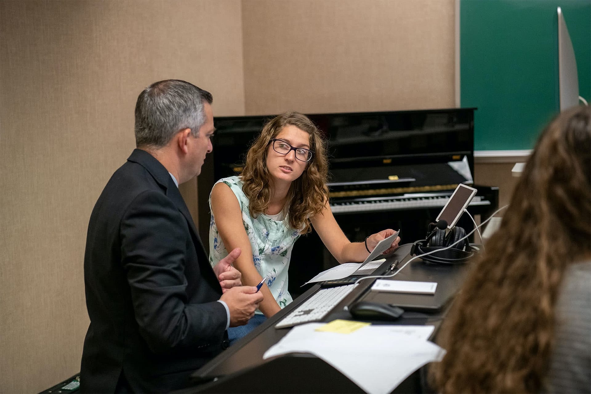 Dr. Bombard helps a student register for classes