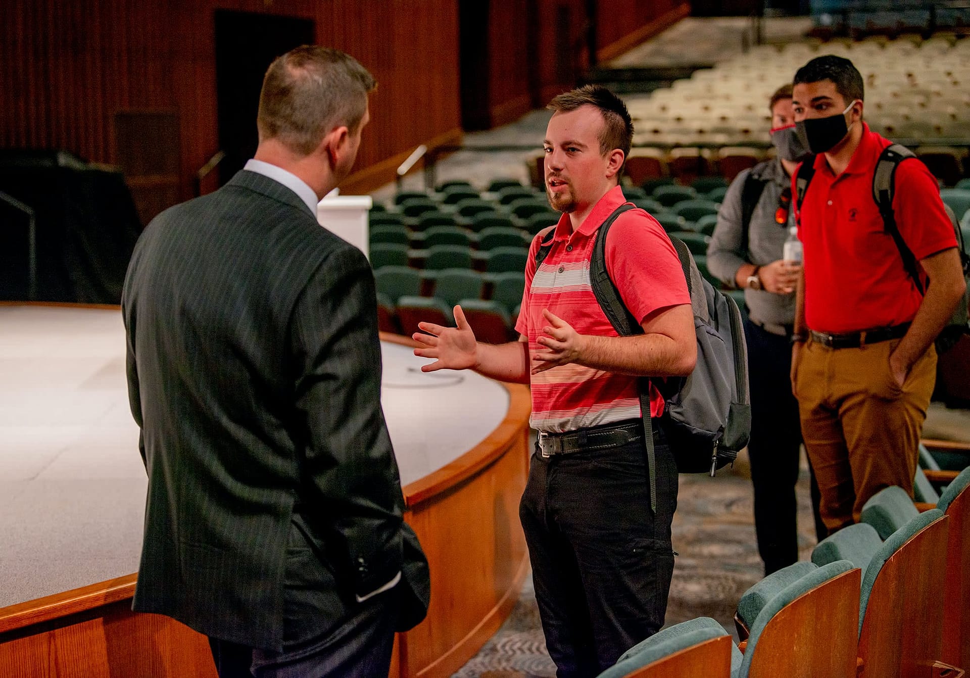 Dr. Folger talking with students in DHA